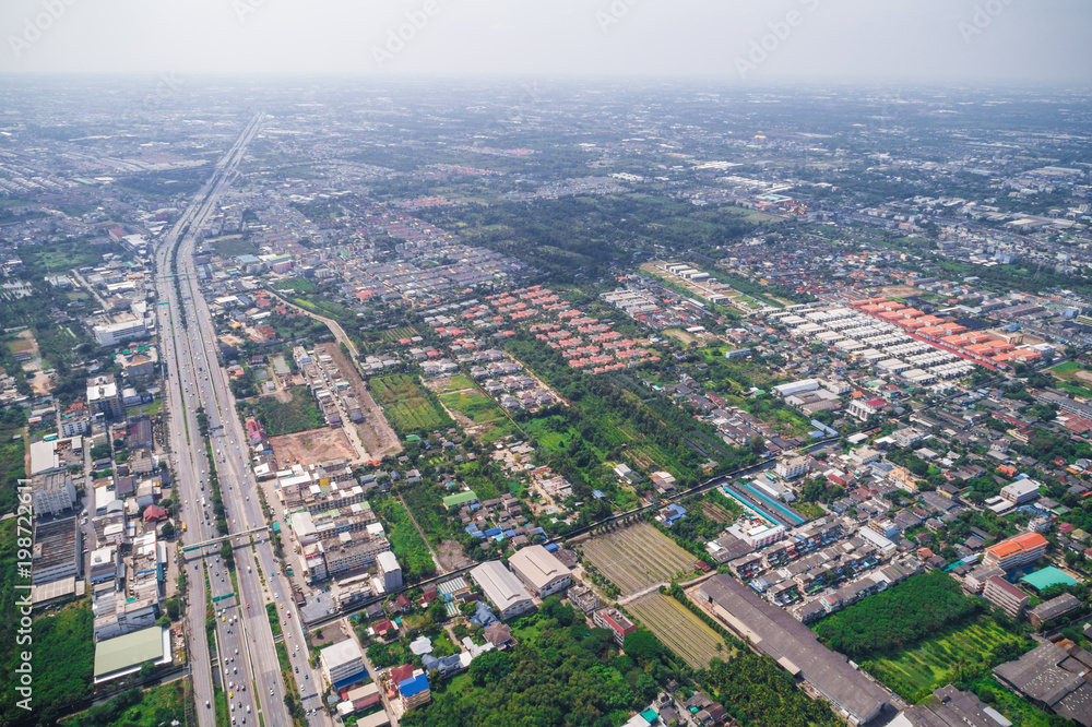 Obraz premium Aerial view of modern city traffic road with building