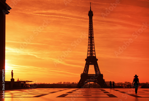 Sunrise over Eiffel tower and tourist on Trocadero plaza