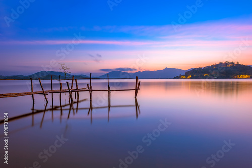 The bamboo bridge on sunrise in Lak lake in Daklak province, Vietnam.