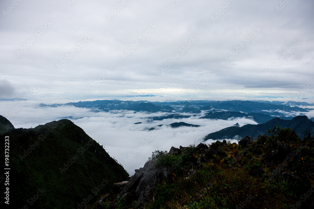 high mountain landscape view background blue sky cloudy , fog around hill . nature national park at chiang dao Thailand . beautiful scene peak wildlife in winter .