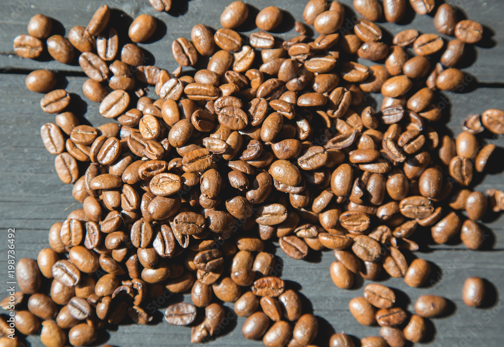 Coffee beans on black wooden background. Coffee beans on black wooden background.