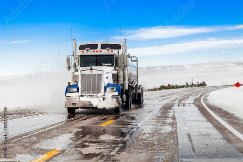 big truck drives on a snowy road