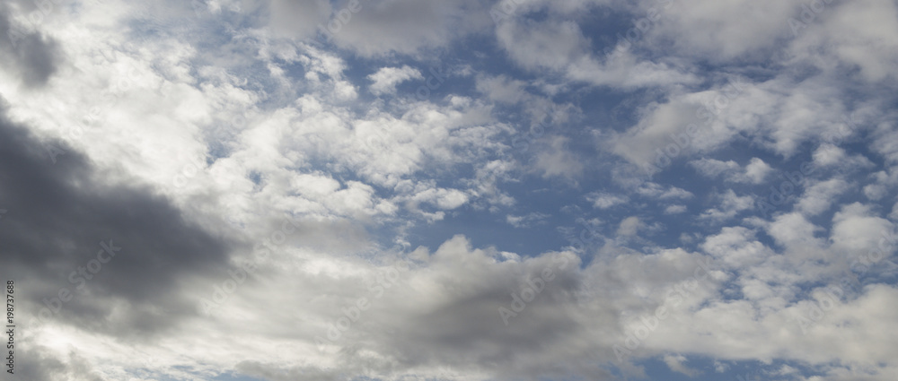 Blue sky background with clouds. White clouds on blue sky. Natural background