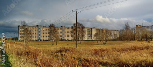 Panoramic cityscape with thunderclouds photo