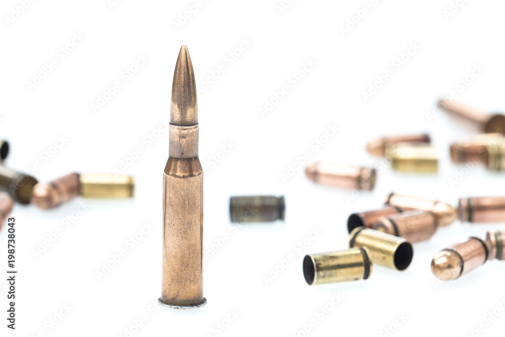 cartridges and scales from various types of weapons / white background.