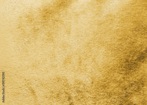 Gold velvet background or golden yellow velour flannel texture made of cotton or wool with soft fluffy velvety satin fabric cloth metallic color material