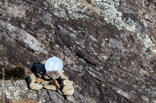 Cryptocurrency mining namecoin in a rock background photo