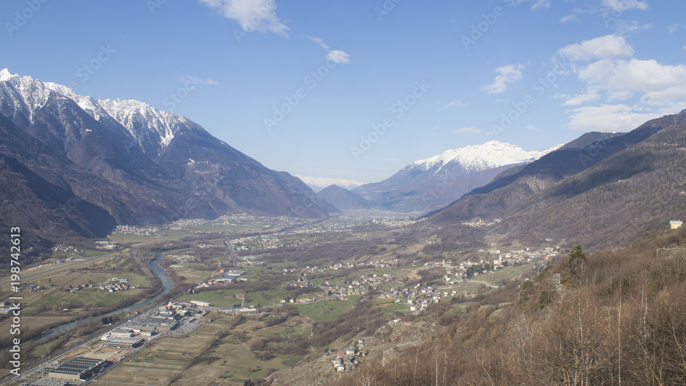 Landscape with mountains trees and houses Landscape with mountains trees and houses