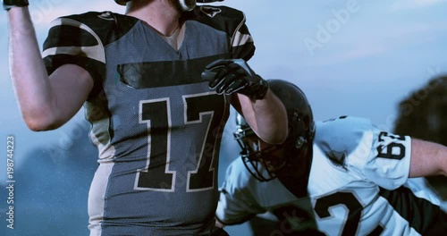 American football players in stadium during game