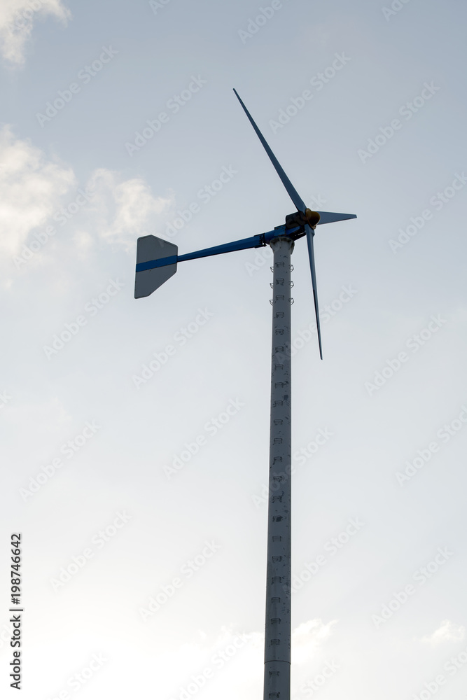Wind turbines standing in the sky, there is a scene in daylight Wind turbines standing in the sky, there is a scene in daylight
