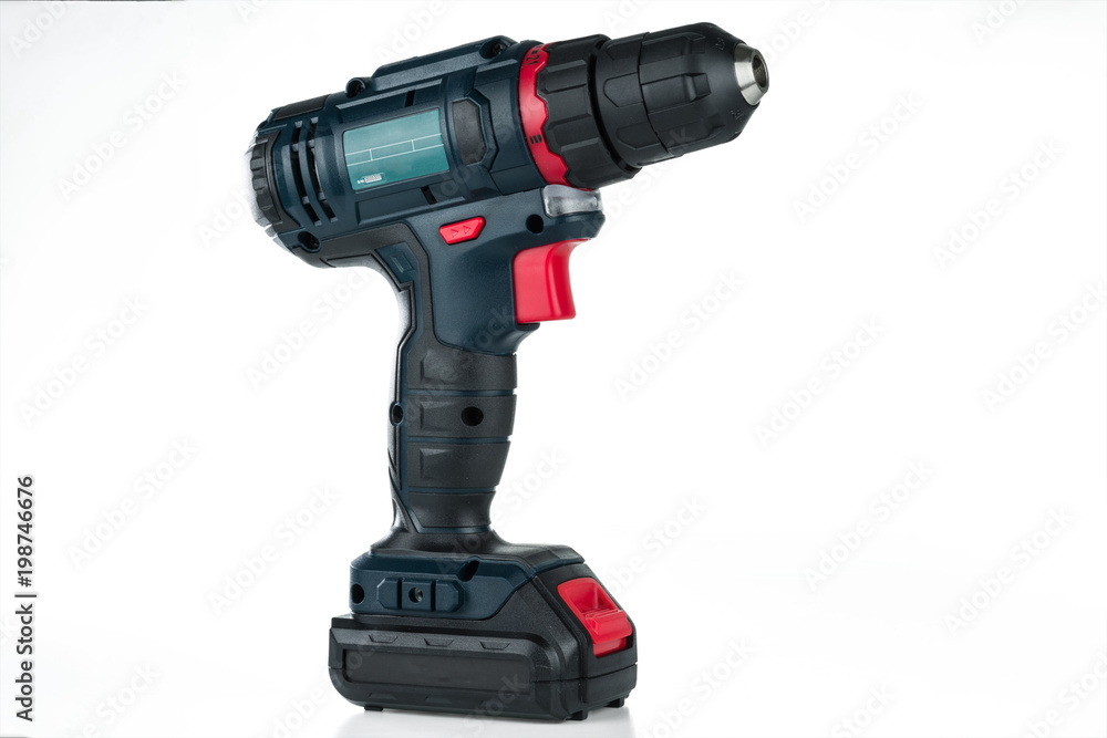 Cordless drill isolated on white background. The universal electric tool.