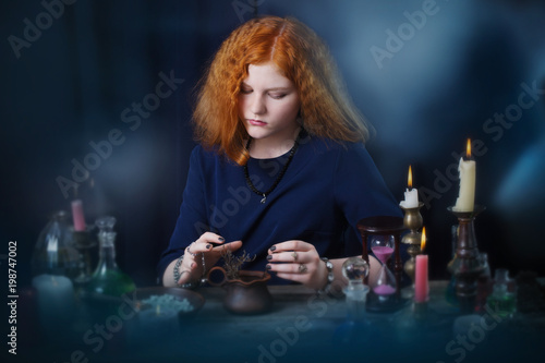  young witch is engaged in witchcraft