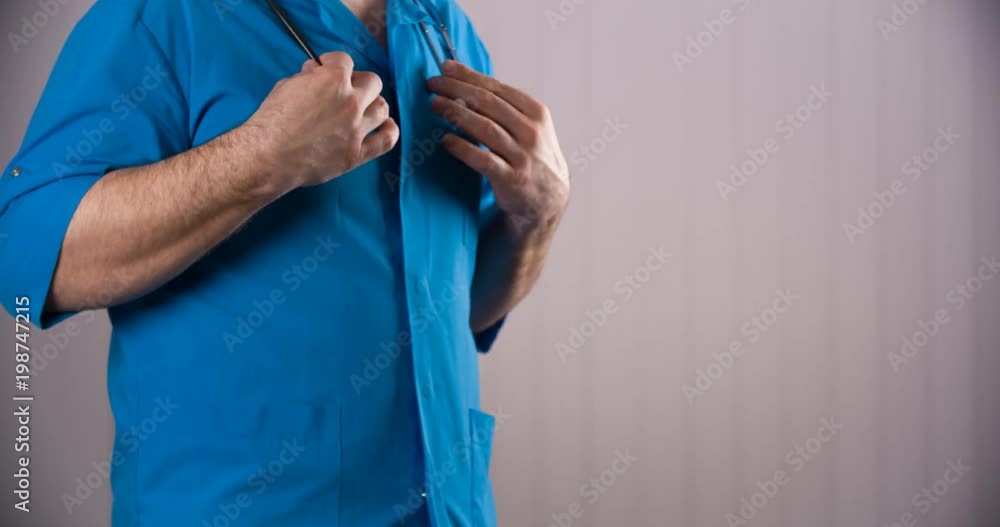 Doctor standing with stethoscope Doctor standing with stethoscope