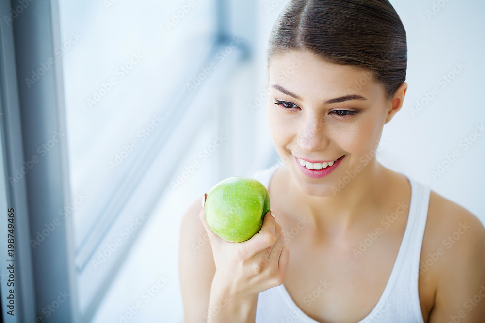 Woman With Apple. Beautiful Girl With White Smile, Healthy Teeth. High Resolution Image Woman With Apple. Beautiful Girl With White Smile, Healthy Teeth. High Resolution Image