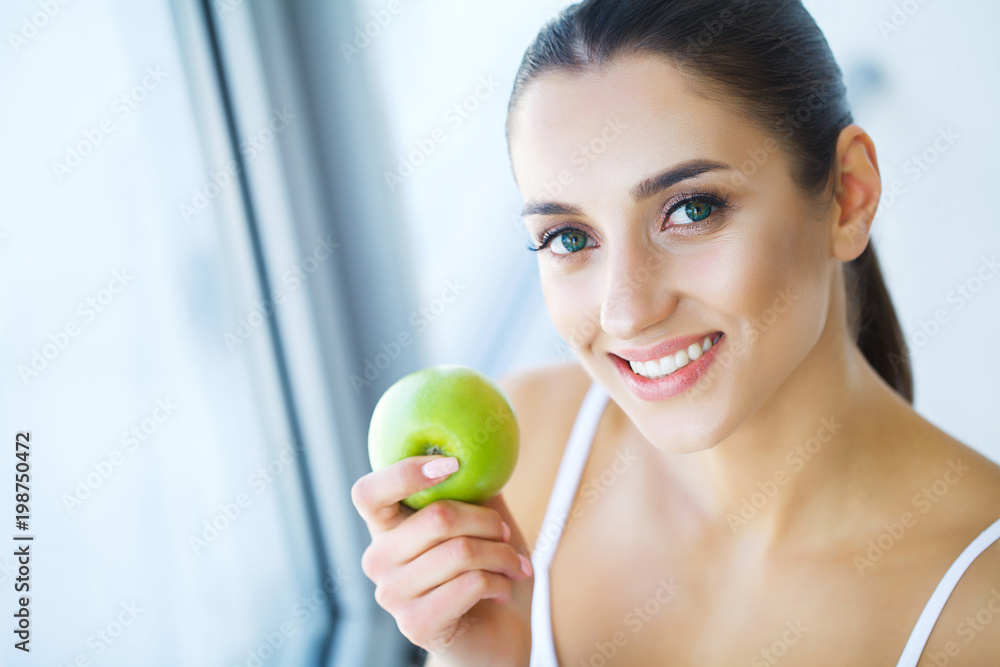 Woman With Apple. Beautiful Girl With White Smile, Healthy Teeth. High Resolution Image Woman With Apple. Beautiful Girl With White Smile, Healthy Teeth. High Resolution Image