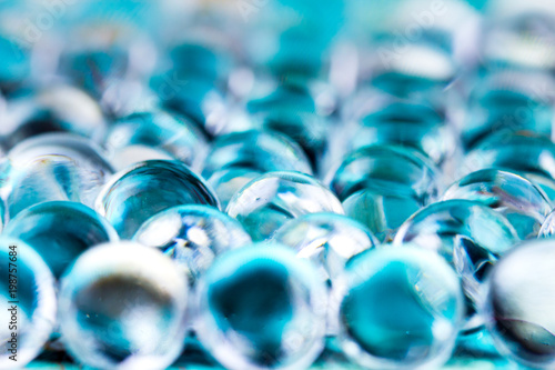 Water blue gel balls. Crystal liquid ball with reflection. Close up macro.