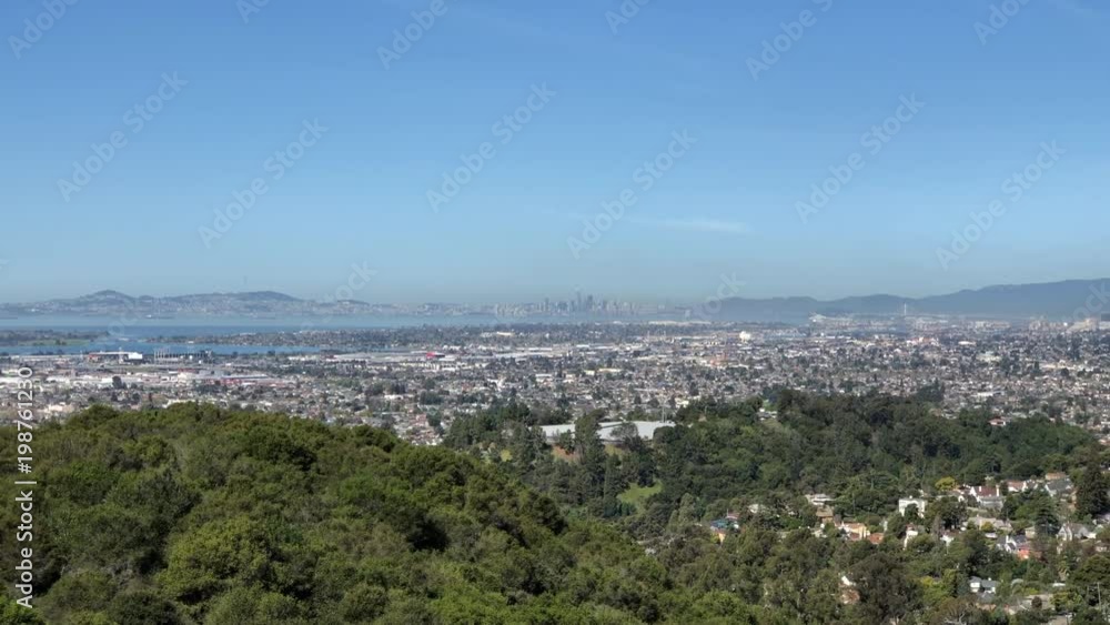 View of Oakland and San Francisco bay from Oakland hills, 4K HD video zooming in from hills to city. View of Oakland and San Francisco bay from Oakland hills, 4K HD video zooming in from hills to city.