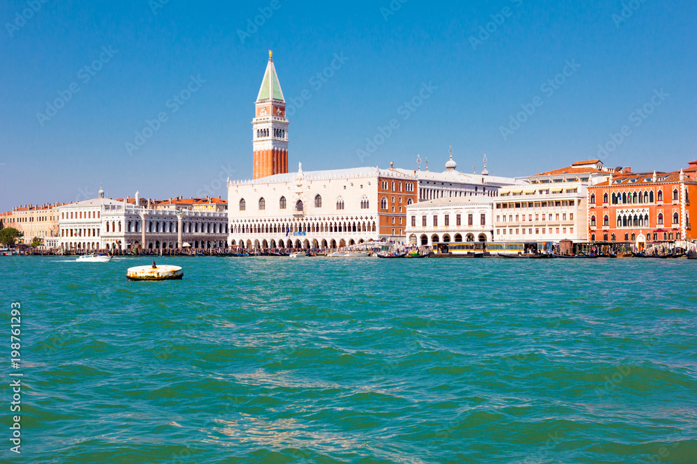 View of Saint Mark's square in Venice, Italy.  Blue lagoon and beautiful cityscape.