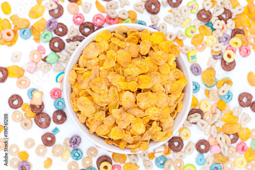 Bowl of corn flex cereals on white background