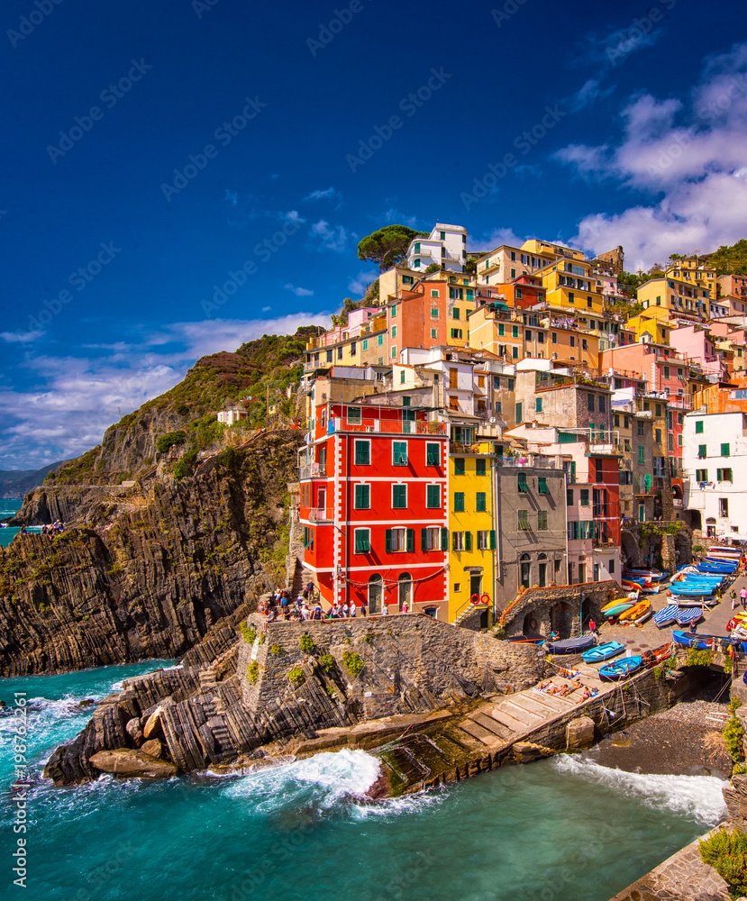 View of the colorful houses along the coastline of Cinque Terre area in Riomaggiore