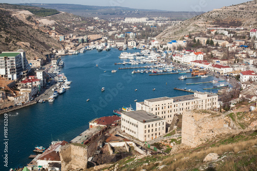 Beautiful view of the Black Sea and the city Balaklava. Balaklava Bay. Clear sunny day and a top view of the port, Crimea