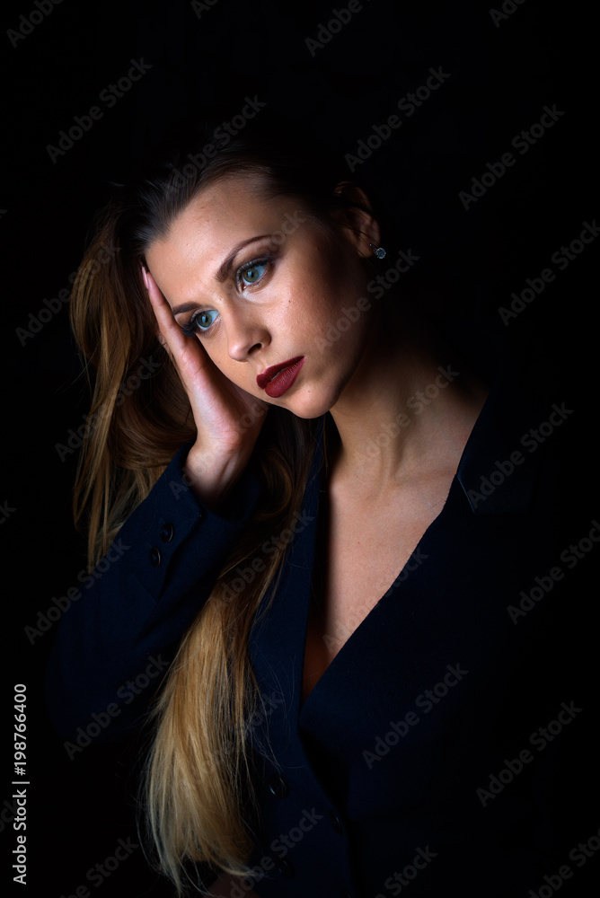 Sexy young blonde with red lips on a black background Sexy young blonde with red lips on a black background