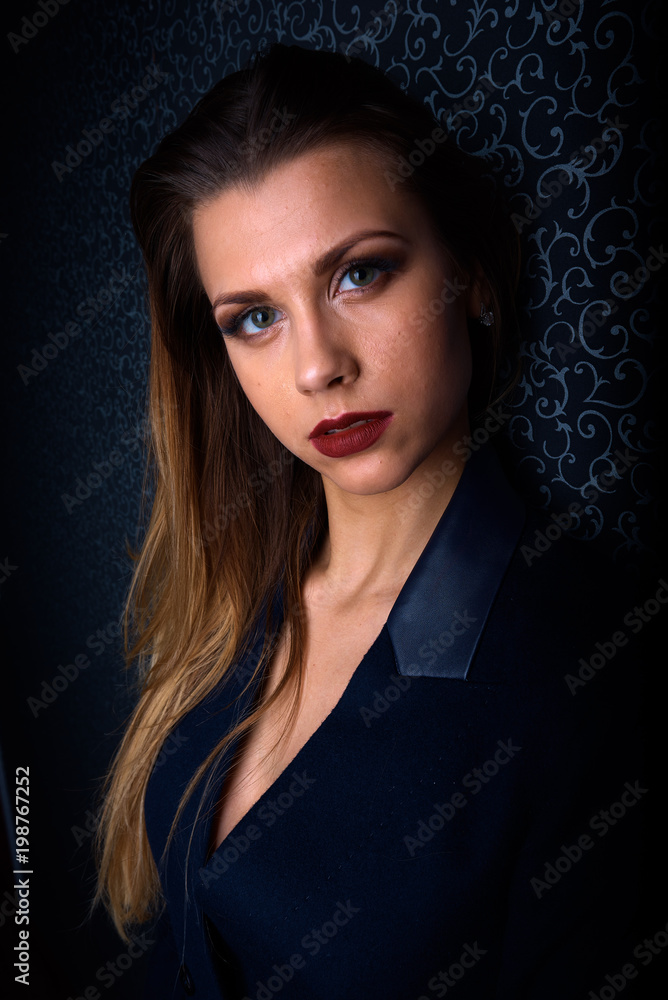 Sexy young blonde with red lips on a black background Sexy young blonde with red lips on a black background