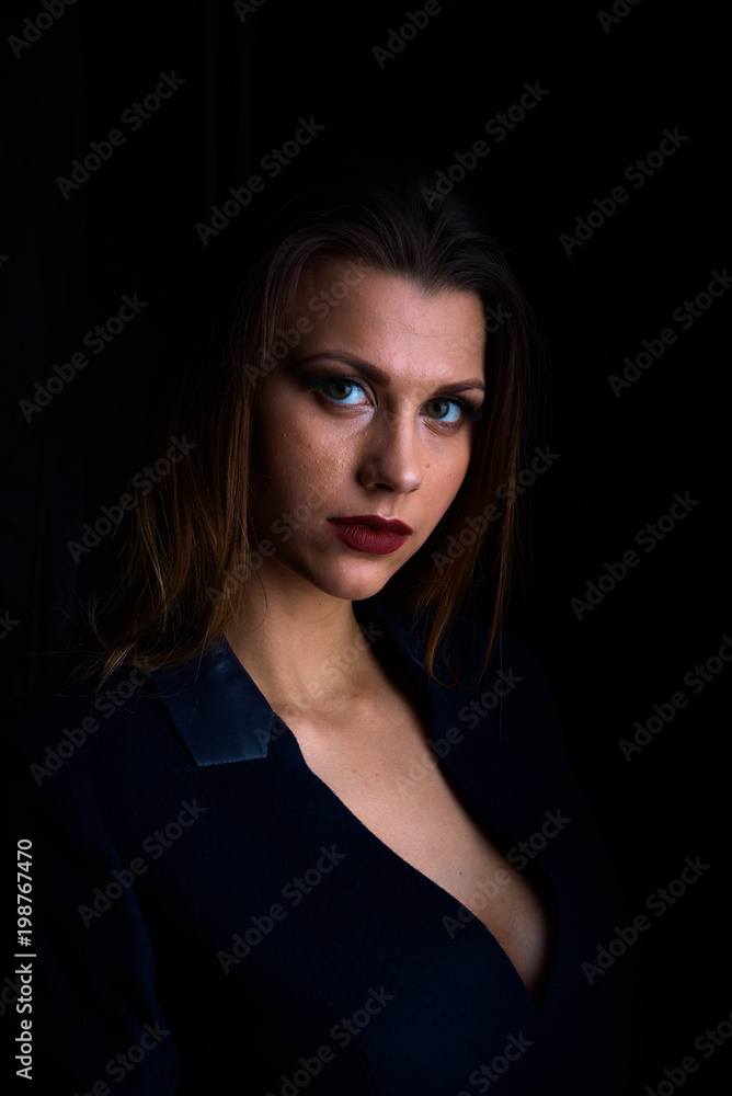 Sexy young blonde with red lips on a black background Sexy young blonde with red lips on a black background