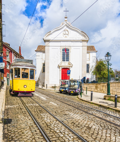 Santa Luzia Church and vintage tram in Lisbon, Portugal photo