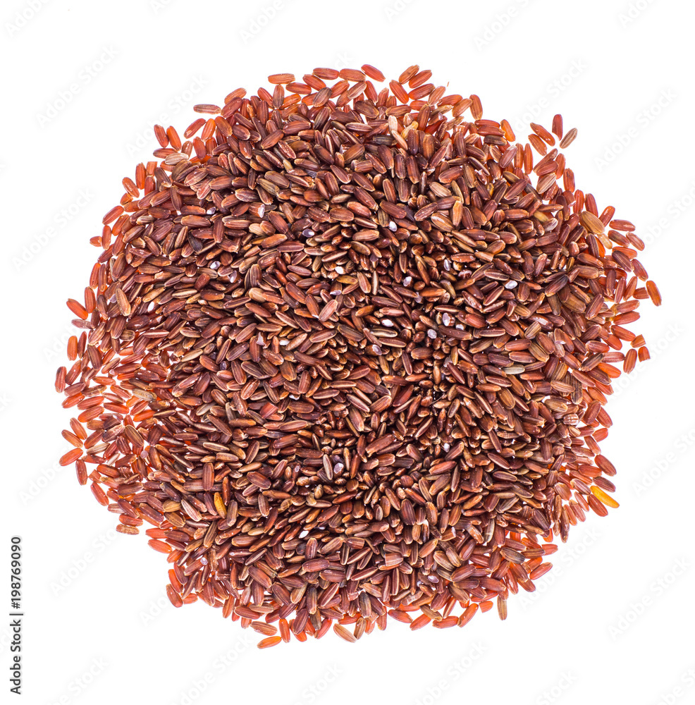 Scattering of red rice on white background closeup Scattering of red rice on white background closeup