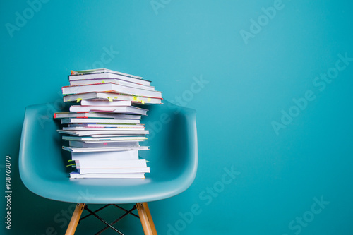 Bild auf Leinwand A stack of books in the interior in a minimalist style