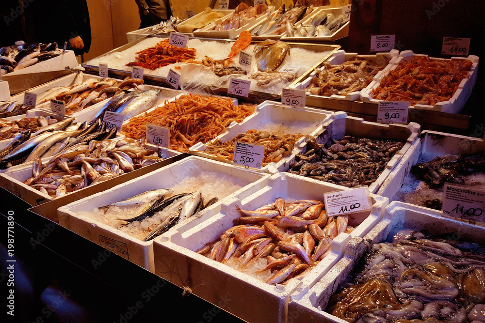 Closeup of food market with fish store. Bologna, Italy