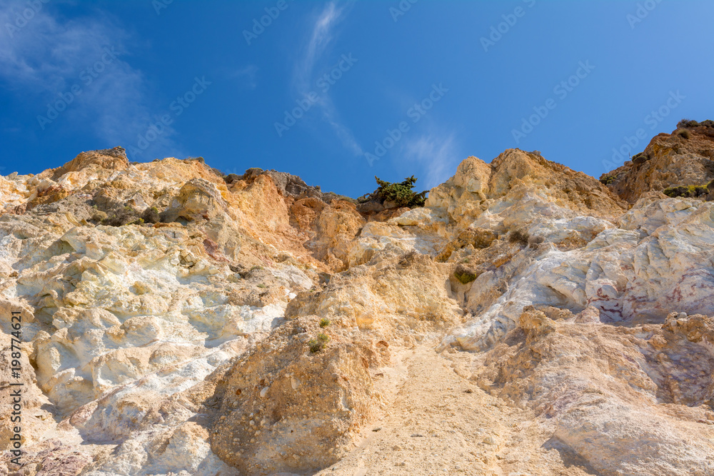 Multicolored rocks on Firiplaka Beach on Milos island. Cyclades, Greece
