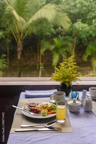 Breakfast overlooking the jungle garden in the Pilgrimage Hotel, Hue, Vietnam