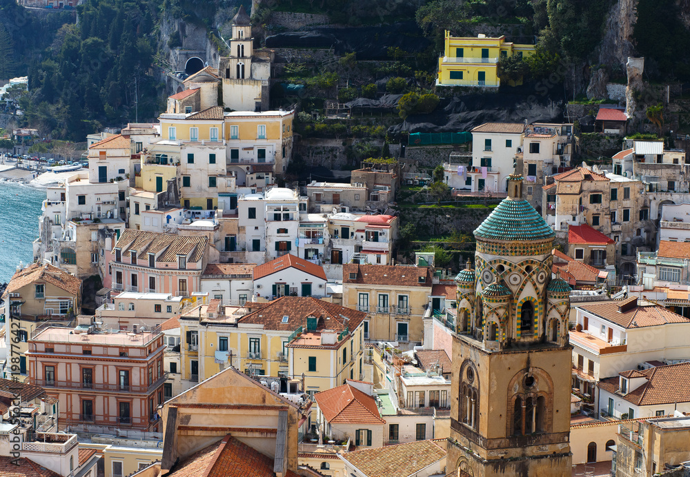 Amalfi, Campania Sorrento, Italy. Top view of the town, church and the seaside in a summer sunset