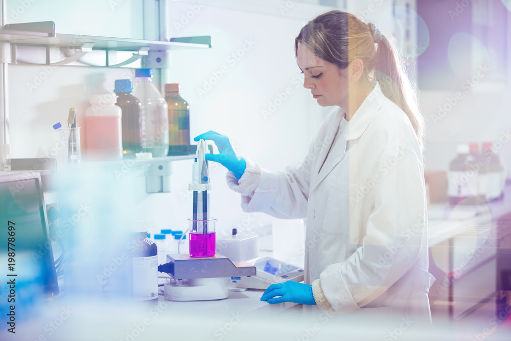 young woman working in a laboratory young woman working in a laboratory