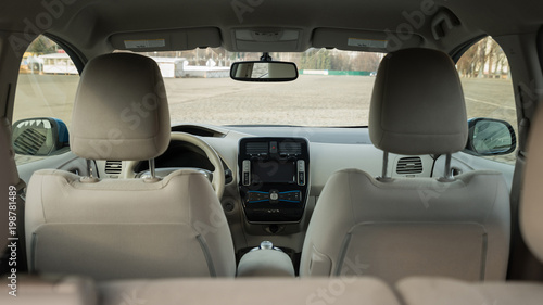 Modern electric car interior. View from back.