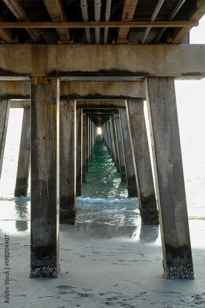 View from Below of Traditional American Pier on Beach View from Below of Traditional American Pier on Beach