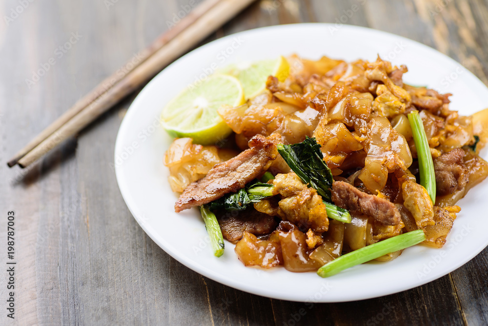 Thai food, stir fried rice noodles in soy sauce (Pad See Ew) Thai food, stir fried rice noodles in soy sauce (Pad See Ew)