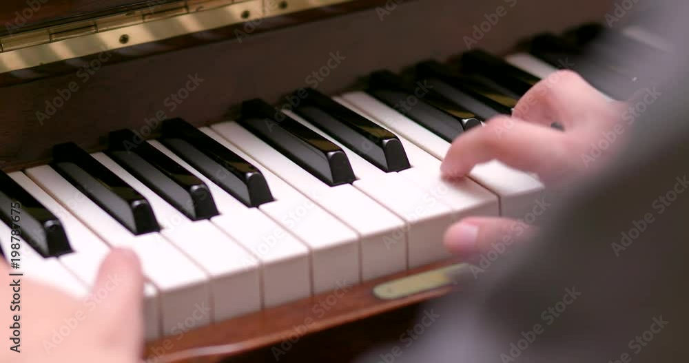 Man practicing piano