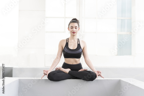 Healthy Yoga at home. Beautiful woman doing yoga pose and meditation.