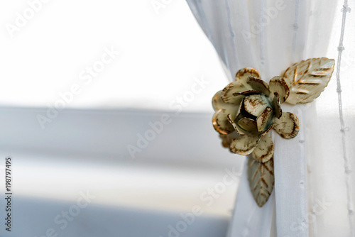 Decorative curtain clip in shape of flower photo