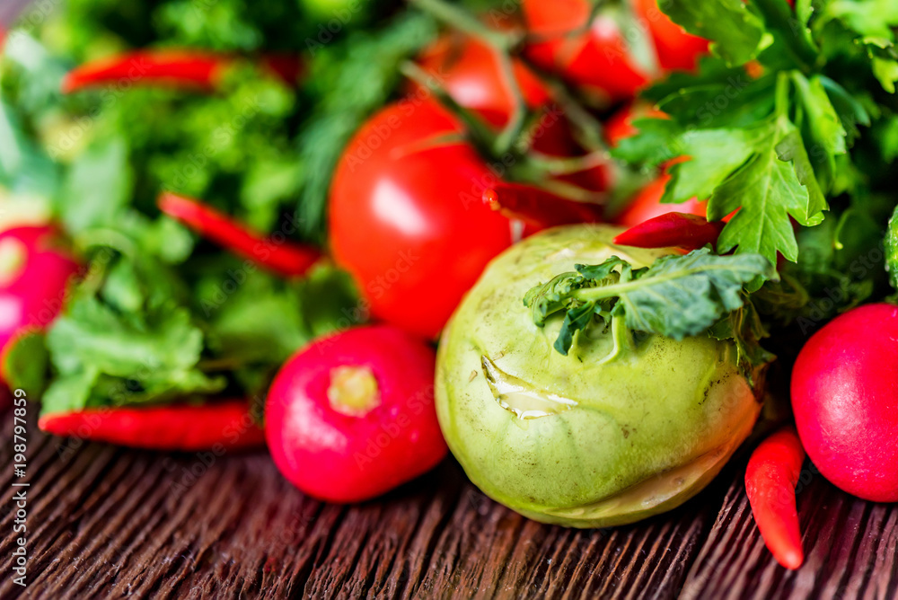 Fresh vegetables and herbs on wooden table Fresh vegetables and herbs on wooden table