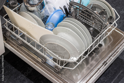 Open dishwasher with clean dishes