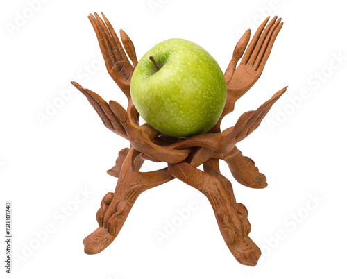 Wooden folding vase in the form of woven hands with an apple.