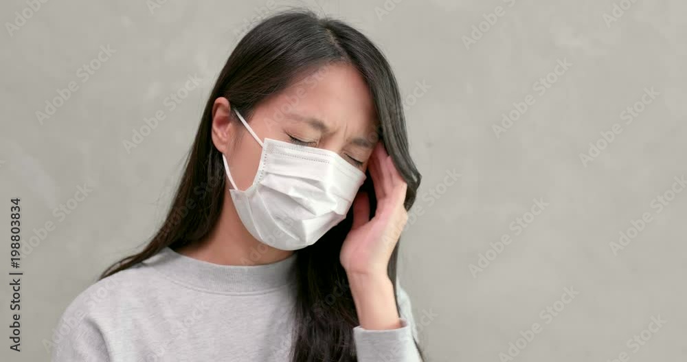 Young Woman wearing mask and feeling headache Young Woman wearing mask and feeling headache