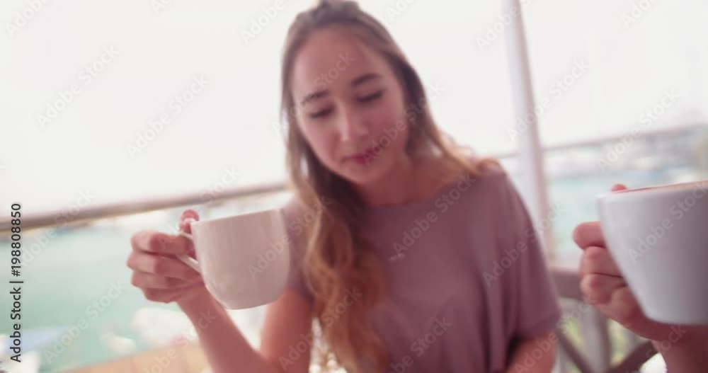 Female best friends drinking coffee at hipster coffee shop Female best friends drinking coffee at hipster coffee shop