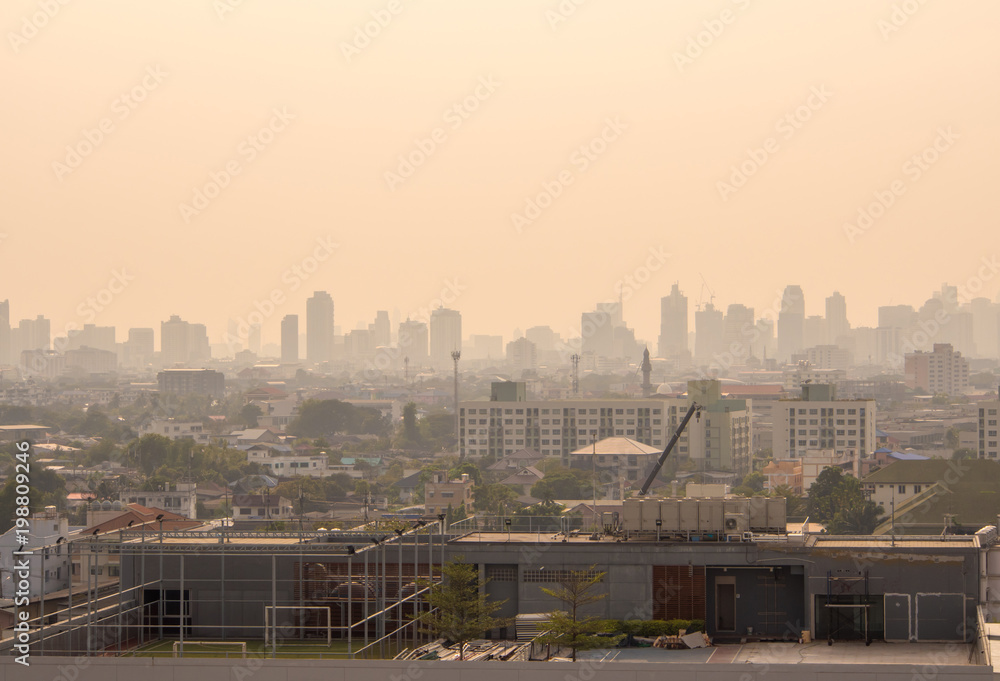 Fototapeta premium Cityscape urban skyline in the mist or smog. Wide and High view image of Bangkok city in the soft light