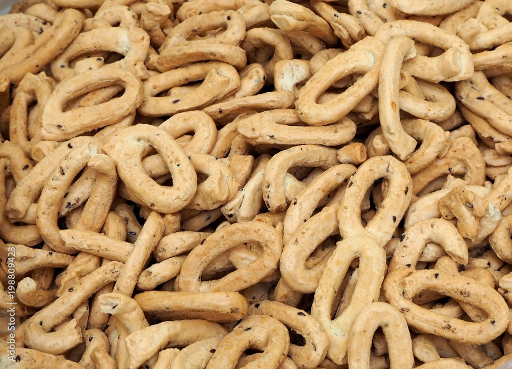 Taralli with cereals, southern italy traditional snack food, similar in texture to bread sticks Taralli with cereals, southern italy traditional snack food, similar in texture to bread sticks