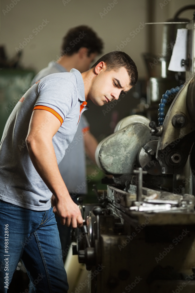 Metal manufacturing engineers in a factory Metal manufacturing engineers in a factory